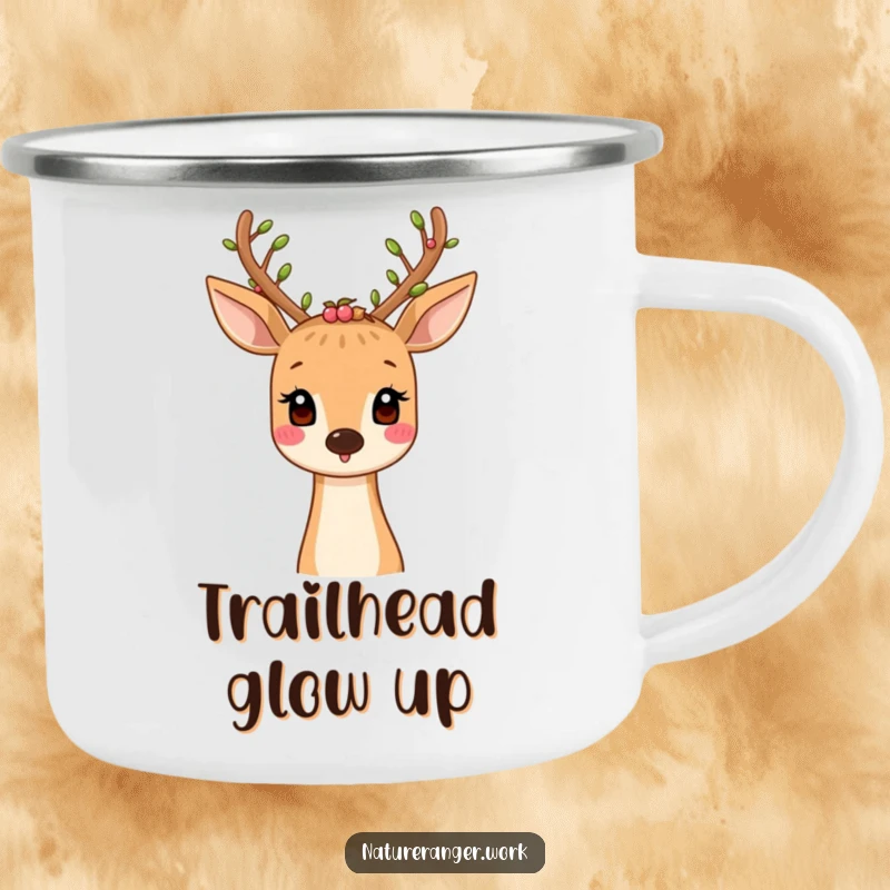 Funny camping mug showing a smiling cartoon deer with leaf and berry-adorned antlers, perfect for nature exploration.