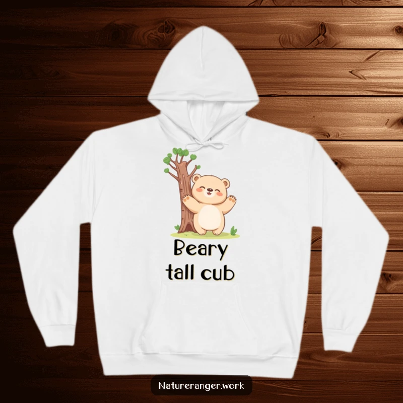 Funny bear cub hoodie showing a giggling, blobby bear pretending to be a tall tree with outstretched paws.